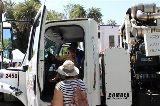 Girl sitting in truck at past Read Rumble Rev event