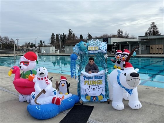 Photo of a child at last year's event surrounded by polar bear-themed display