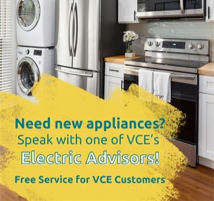 Photo of kitchen with refrigerator, washing machine, and other appliances