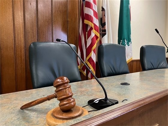 Photo of City Council chambers dais with gavel