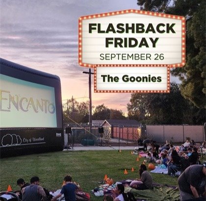 Photo of Freeman Park during a past outdoor movie with the text "Flashback Friday - The Goonies"