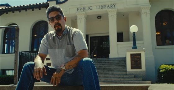Screen capture of spoken word artist Tomas Montoya in front of the Woodland Public Library during the Dear Woodland video