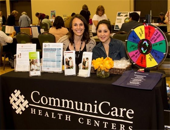 Two CommuniCare Staffers Smiling at 2023 Resource Fair Event