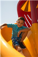 Boy Going Down Slide