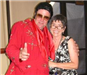 Woman with man dressed as Elvis