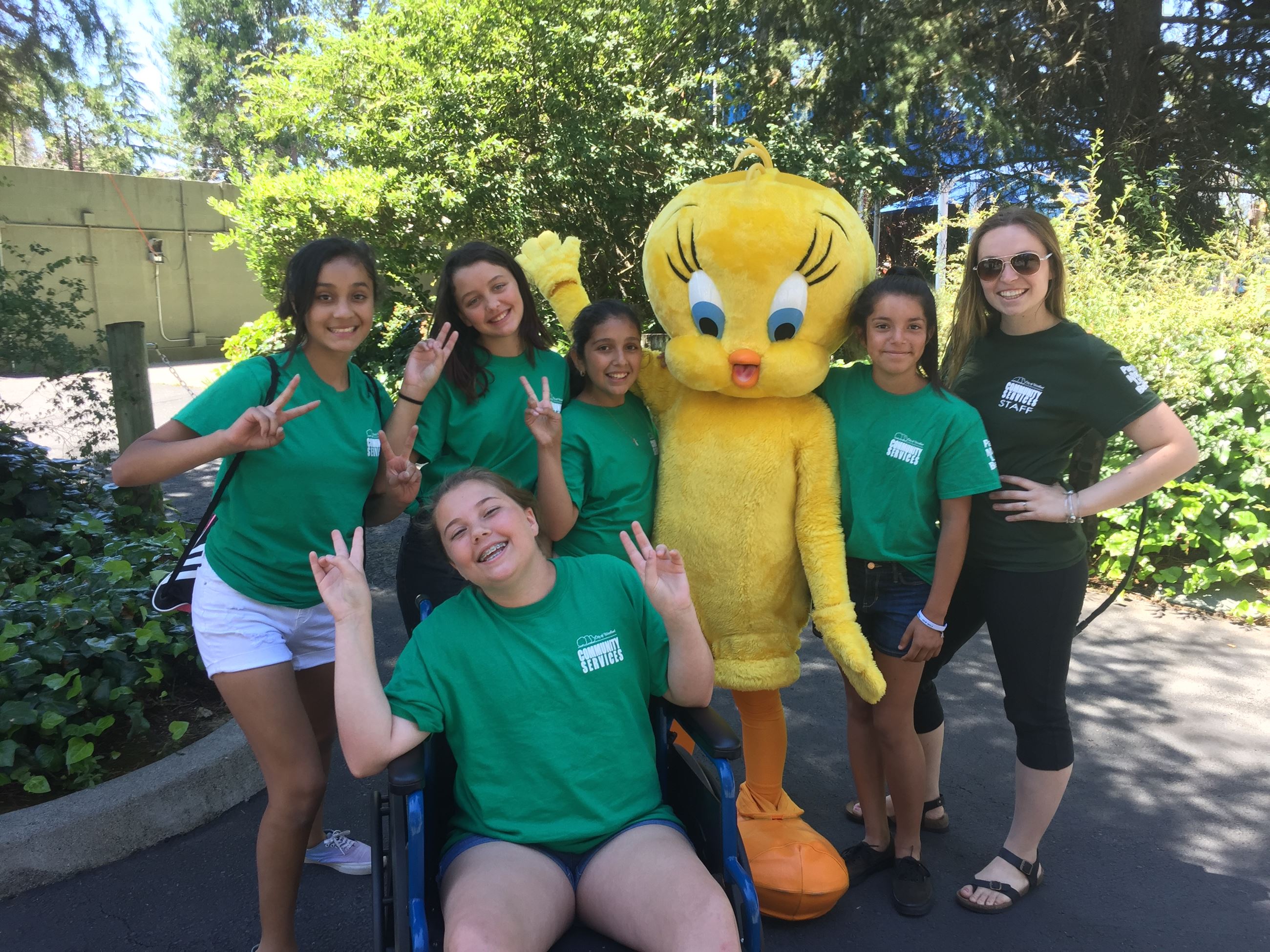 Teens posing with Tweety Bird