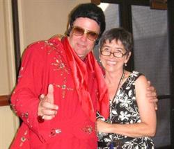Woman with man dressed as Elvis