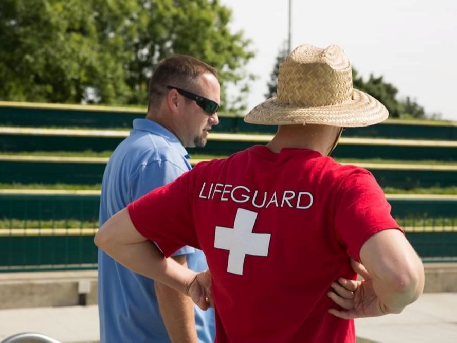 Man in Lifeguard shirt