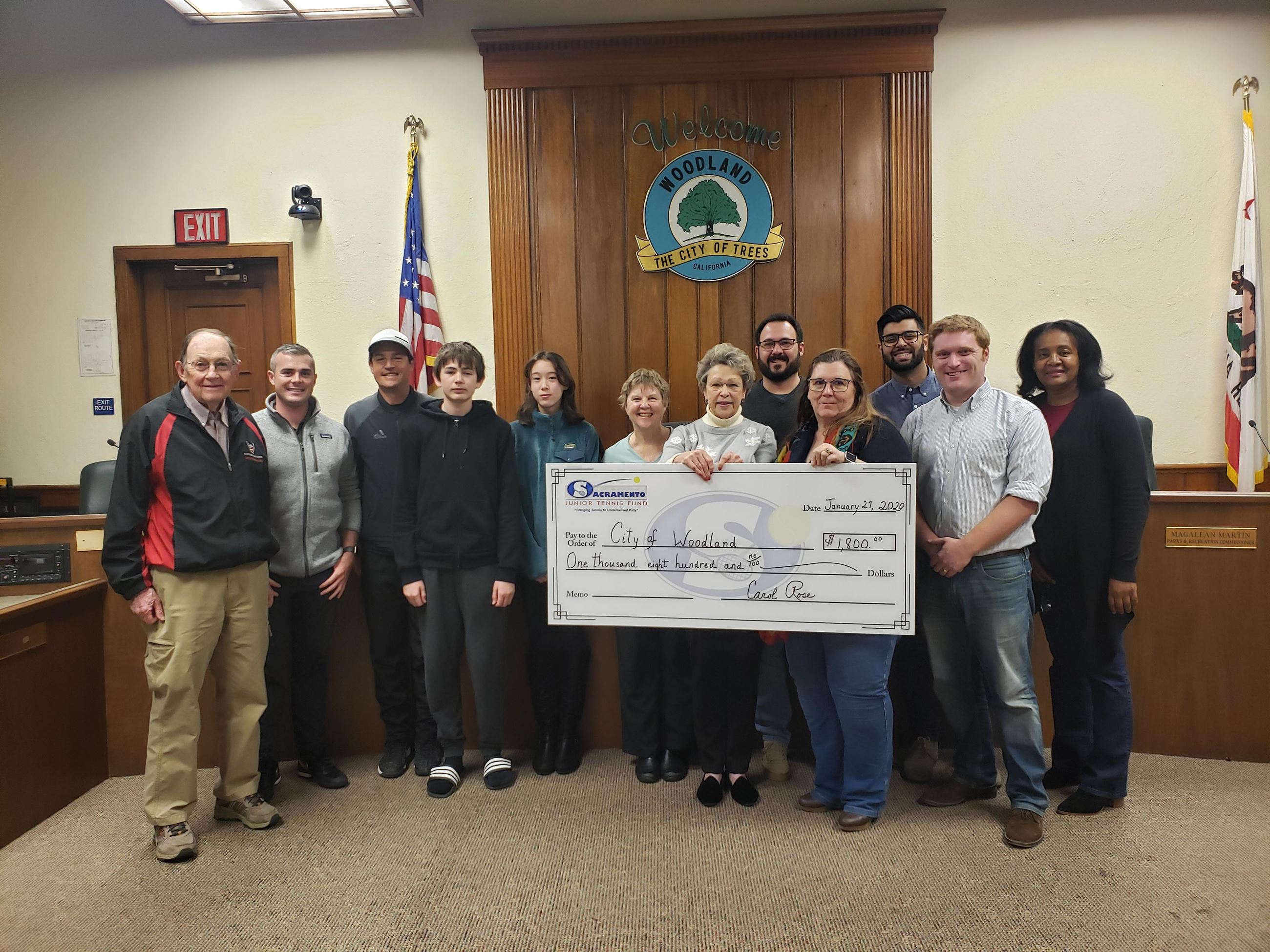 Woodland staff receiving check from Sacramento Jr. Tennis Fund